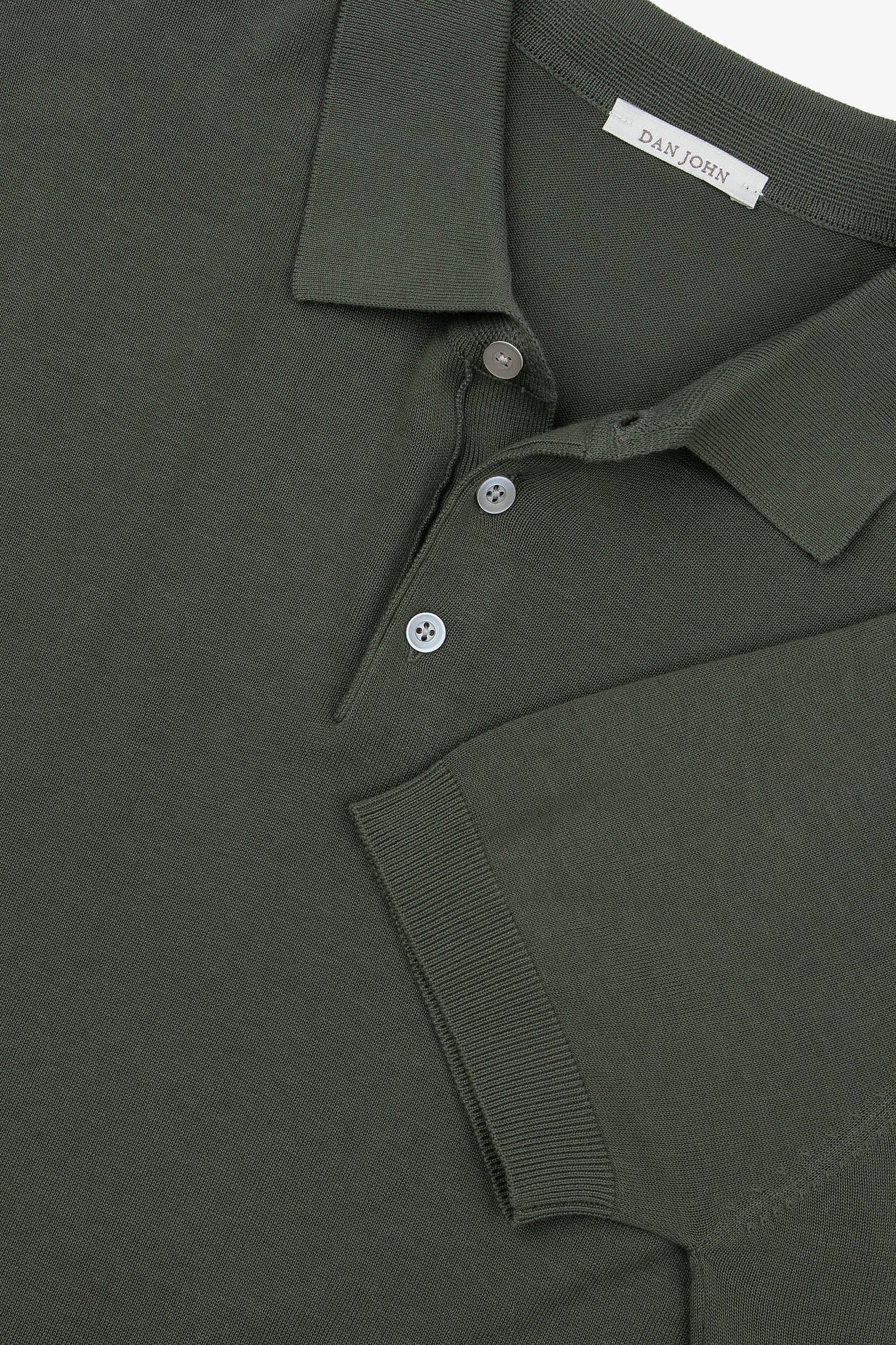 Dark green knit short-sleeve polo shirt with a spread collar, three-button placket, and ribbed cuffs.