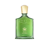 A translucent green glass bottle of Creed Wild Vetiver perfume with a gold cap, featuring the embossed Creed logo and gold lettering against a white background.