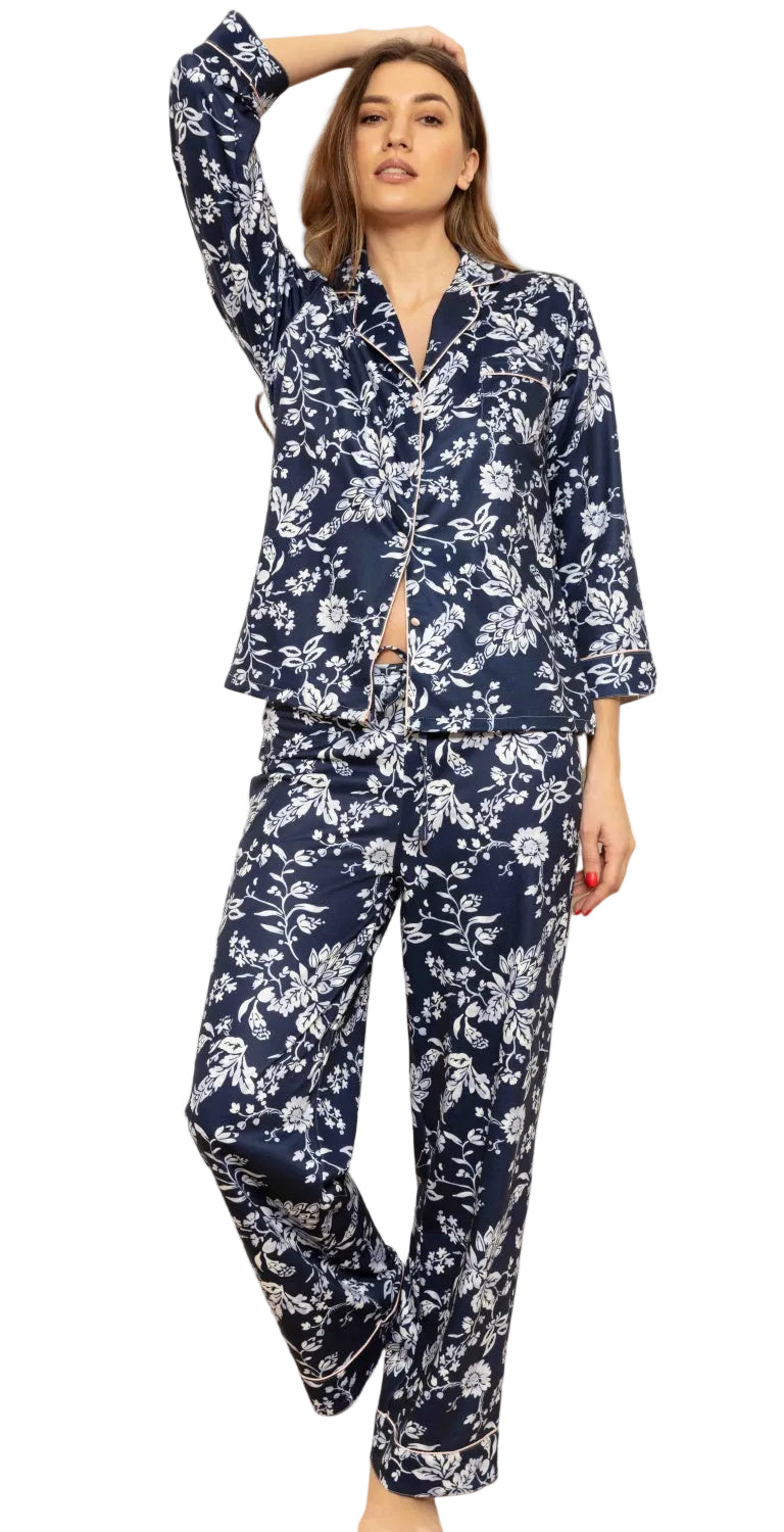 Midnight blue cottonfleece pyjama set with white floral pattern, featuring a long-sleeved collared top and matching trousers.