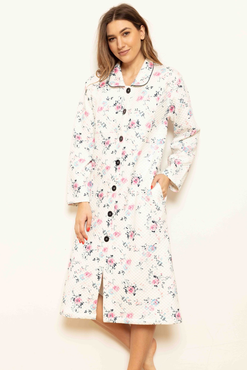 Cream quilted robe with pink and blue floral print, black-piped spread collar, black button-front closure, long sleeves, and
