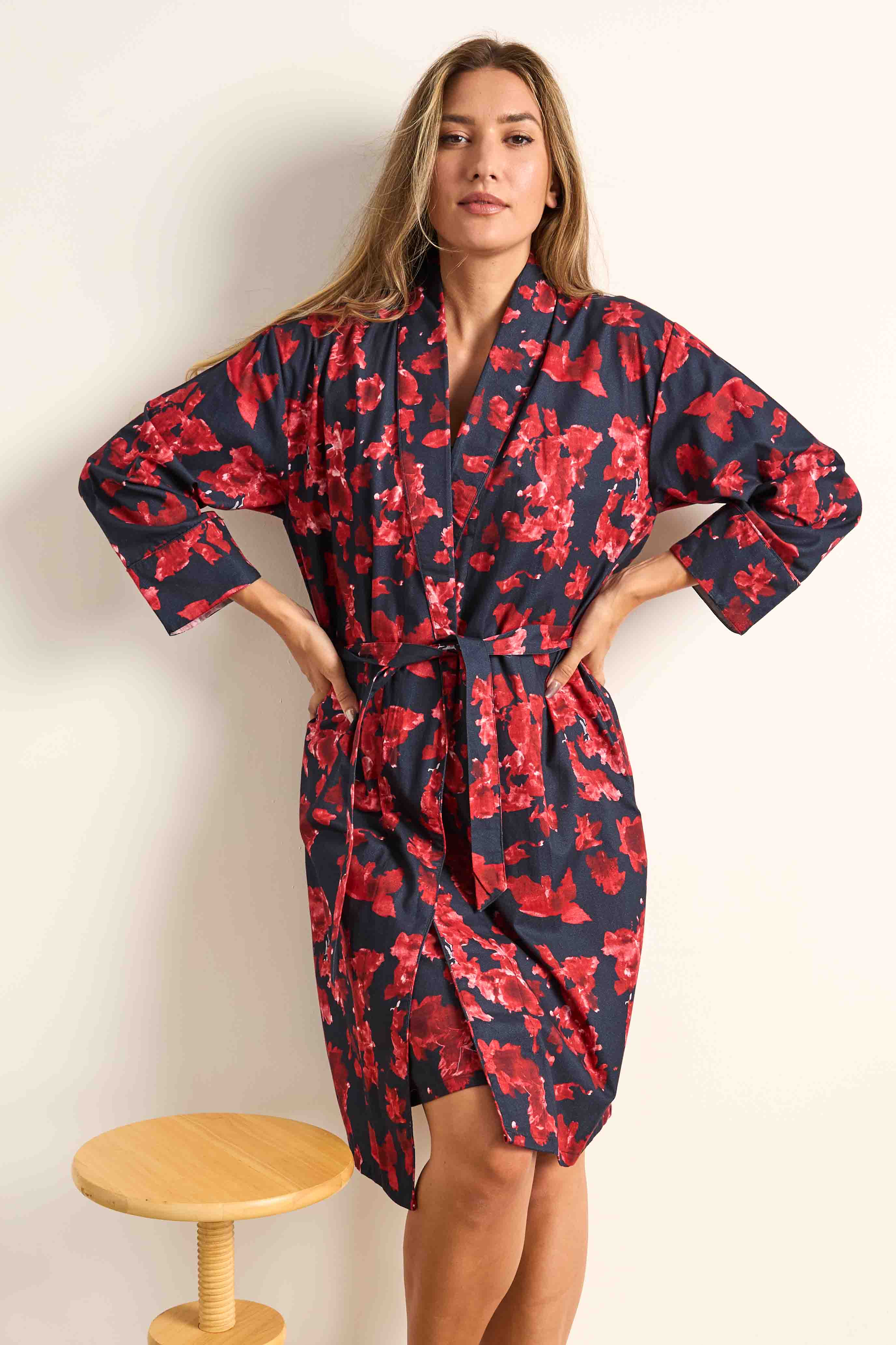 Navy twillpoplin robe with crimson red watercolor floral pattern, shawl collar, long sleeves, and matching tie belt.