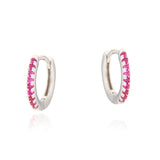 Pair of small silver hoop earrings, each adorned with a row of small, round, ruby-coloured faceted stones along the outer edg