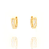 Pair of small gold-toned oval hoop earrings with three rows of clear pavé-set stones on the front.