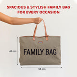 Kaki canvas tote bag with brown leather-like trim, handles, and gold-toned rivets. Front has 'FAMILY BAG' in black and a 'CHI