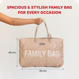 Puffy beige quilted tote bag with diamond stitching, two top handles, a gold-toned 'CHILDHOME' label, and 'FAMILY BAG' text o