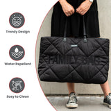 Black quilted puffer changing bag with diamond stitching. Features 'FAMILY BAG' text and 'CHILDHOME' label on the front, with