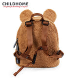 Beige teddy fleece backpack with two rounded bear ears, brown adjustable shoulder straps, a top handle, and a side zipper.