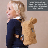Beige teddy fleece kids' backpack with rounded ears, front zipper pocket, side zipper, and brown adjustable straps. 'FIRST' t