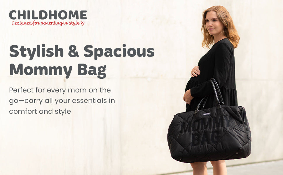Large black quilted duffel bag with "MOMMY BAG" embossed on the front, two top handles, and a top zipper.