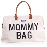 Large off-white Childhome Mommy Bag with black "MOMMY BAG" text, brown faux leather top handles, and a zip closure.