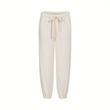 Front view of Citizens of Humanity beige jogger pants featuring an elasticated drawstring waistband and gathered elastic ankle cuffs against a plain white background.