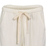 Close-up detailed view of the comfortable elasticated waistband and matching tonal drawstring knot on the Citizens of Humanity beige casual trousers.