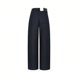 Back studio view of Citizens of Humanity navy trousers, highlighting the clean high-waisted tailoring, smooth rear patch pockets, and premium fabric texture against a white background.