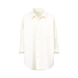 Front studio view of a Citizens of Humanity White button-down shirt, showcasing its relaxed point collar, single chest pocket, and curved tunic hem against a white background.