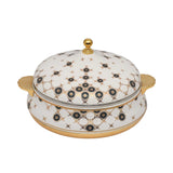 Casa Blu luxury white insulated food warmer with gold-plated base and handles, decorated with black and gold geometric sunburst patterns on the body and lid.