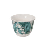 Top-down view of an 18-piece Casa Blu luxury drinkware set in a presentation box, featuring 6 tea glasses, 6 Cawa cups, and 6 saucers with a teal Lily of the Valley floral pattern.