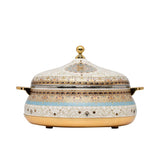 Casa Blu insulated food warmer featuring an intricate cream and gold floral pattern with a turquoise horizontal band, gold-plated base, handles, and lid finial.