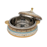 Casa Blu insulated food warmer featuring an intricate cream and gold floral pattern with a turquoise horizontal band, gold-plated base, handles, and lid finial.