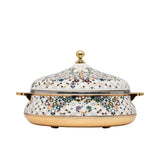 Casa Blu insulated food warmer with a white body covered in a multicolor geometric star mosaic pattern, featuring gold-plated handles and base.