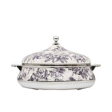Casa Blu insulated food warmer featuring a black and white vintage floral and leaf pattern with polished silver-tone handles and a round lid knob.