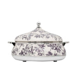 Casa Blu insulated food warmer featuring a black and white vintage floral and leaf pattern with polished silver-tone handles and a round lid knob.