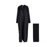Front view of a Casa Johara Fashion black abaya featuring geometric embossed patterns and a tailored lapel collar, shown with a matching black sheila.