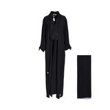 Front view of a Casa Johara Fashion black abaya featuring a wide floral lace collar and lace-trimmed cuffs, shown with a matching sheila.