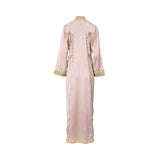 Back view of the rose dust caftan showing the tailored fit, gold piping on the shoulders, and the subtle metallic pinstripe pattern.