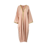 Front view of a CASA JOHARA FASHION rose gold satin kaftan featuring a V-neckline and gold braided trim.