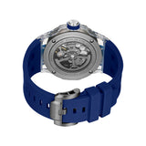 Rear perspective view detailing the mineral crystal exhibition caseback that exposes the automatic rotor, paired with a view of the gunmetal pin buckle and blue silicone strap loops.