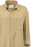 Close-up structural detail of the front on the Citizens of Humanity beige shirt, focusing on the branded white interior label, neat button placket, and single patch pocket.