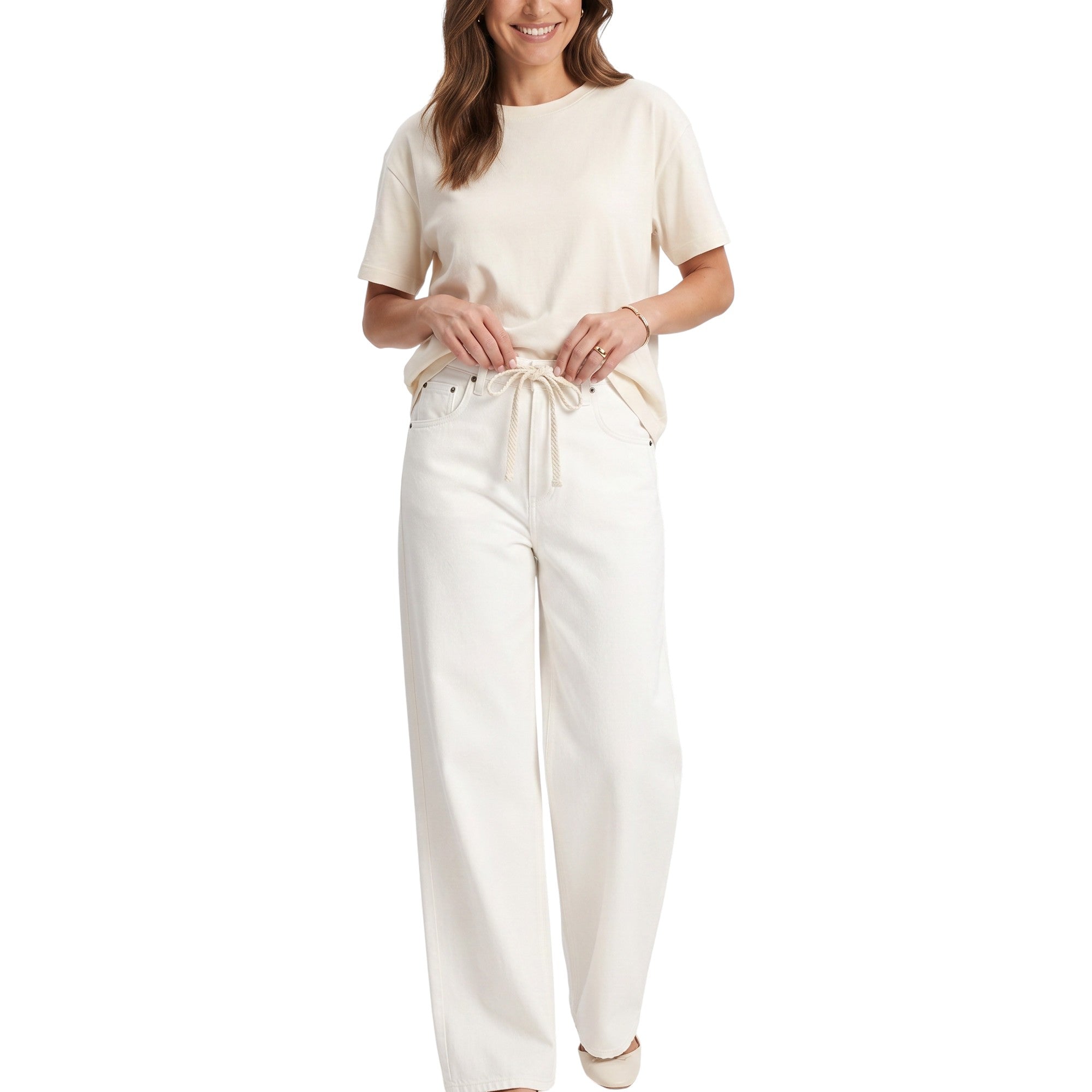 Cropped model shot of a smiling person wearing Citizens of Humanity high-rise wide-leg drawstring trousers in white, styled simply with a cream-colored t-shirt.