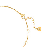 A close-up macro shot focusing on the polished gold-plated lobster claw clasp, the two integrated sizing jump rings, the extension link chain, and the flat dangling Escada monogram end tag.