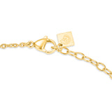 Focused product view of the gold-plated lobster claw clasp mechanism, multi-ring extension chain, and the square logo signature tag.