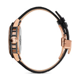 Full side profile view demonstrating the structural open-work cuts along the black midcase and the integrated rose gold butterfly deployment clasp.