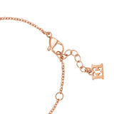 A detailed macro shot of the rose gold-plated lobster claw clasp mechanism on the Escada Madelene bracelet, featuring the adjustment rings and the suspended solid monogram end tag.