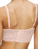 Close-up back view of model wearing the Triumph Sensual Spotlight light pink corset, showcasing the intricate lace panels and the adjustable straps with back closure. Now Available Online