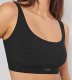 Close-up view of model wearing the Sloggi Ever Ease black bra top, showing the wide shoulder straps and seamless, wire-free design. Available Now Online