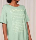 Close-up view of model wearing the Triumph green short sleeve nightdress, highlighting the relaxed silhouette and soft-touch fabric. Shop the Latest Online