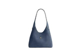 Back profile of the Coach Brooklyn Shoulder Bag blue leather showcasing the minimalist design and embossed logo.