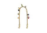 A gold-tone curb chain bag strap from Coach featuring various colorful charms, including a green dinosaur, red cherries, a black spider, and a signature 'C' logo, shown against a plain white background.