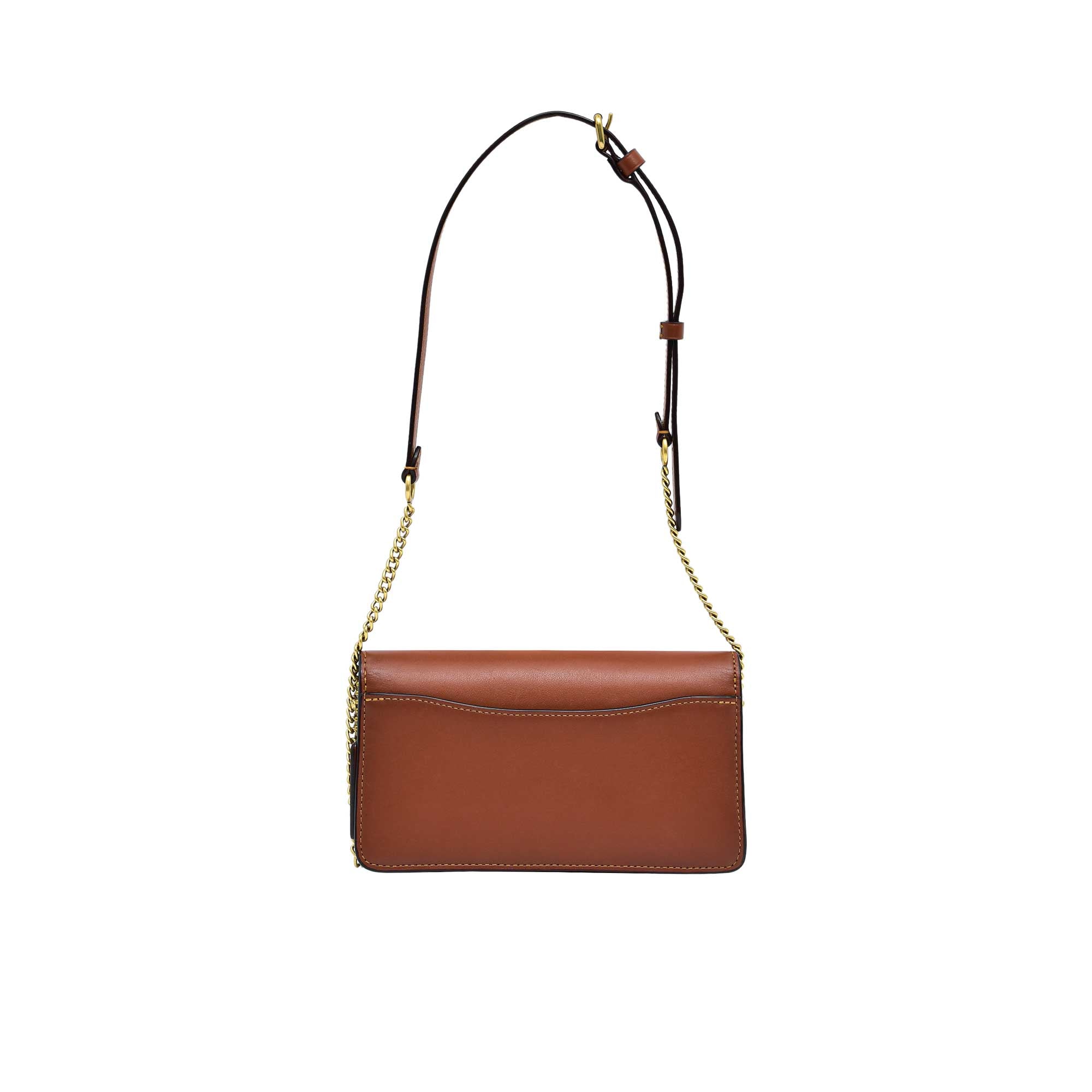 Back view of the Coach Tabby shoulder bag in high-shine metallic silver leather, showcasing a clean, minimalist design with a functional exterior slip pocket and tonal stitching.