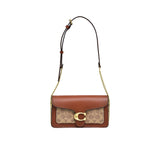 Front view of the Coach Tabby Shoulder Bag 26 in metallic silver leather, featuring a structured rectangular shape, a prominent silver signature C logo clasp, and a short matching leather top-handle against a white background.