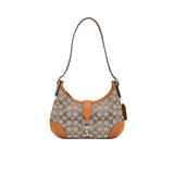 Handbag with brown and beige pattern on a white background.