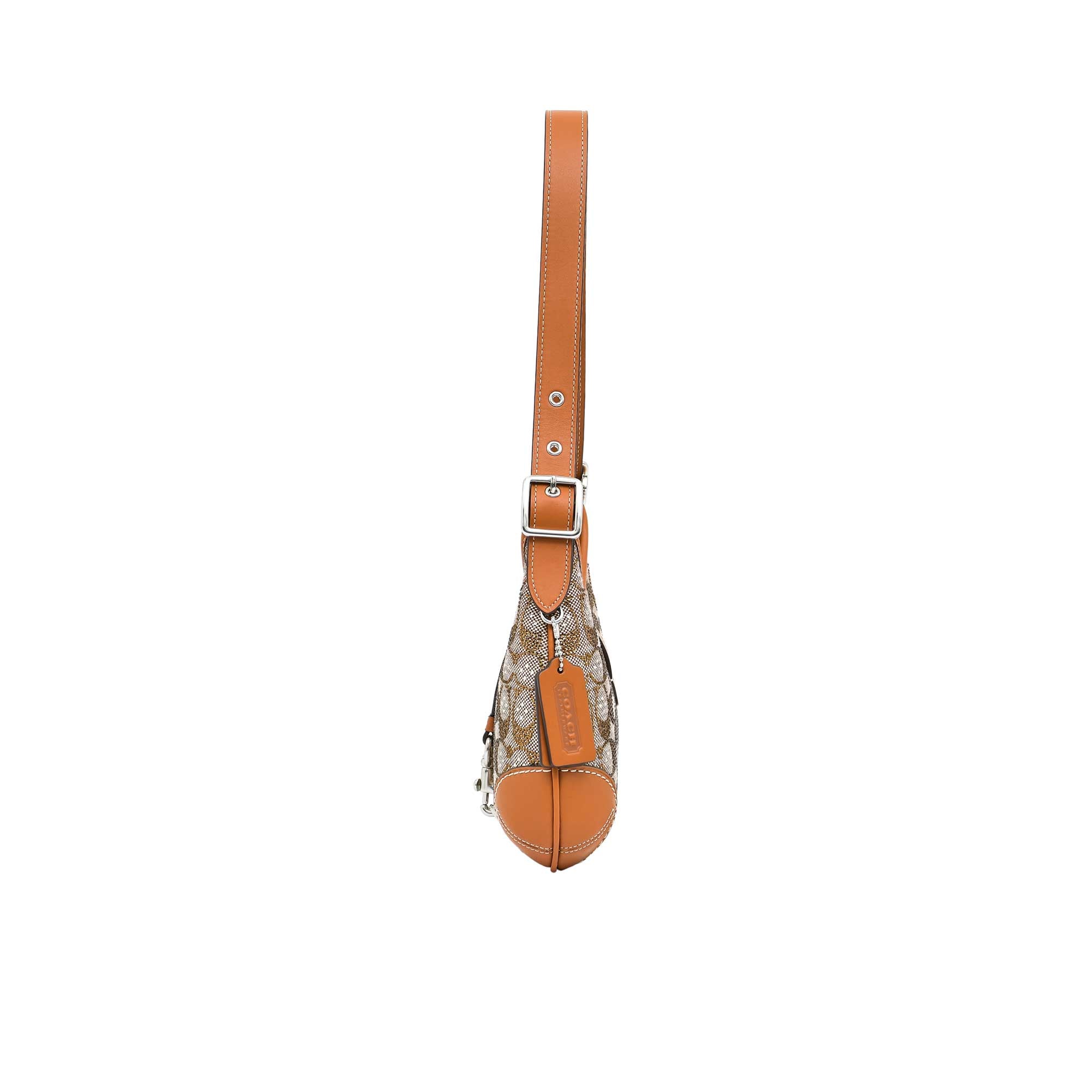 Patterned bag with a brown strap on a white background.