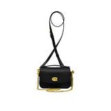 Front view of a compact Coach Tabby wristlet bag in metallic silver leather, featuring a small rectangular shape, a silver signature C logo clasp, and a detachable wristlet strap against a white background.