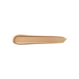 A long, narrow swatch of smooth, beige liquid concealer with a rounded end and a tapered, uneven end.