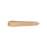 A horizontal swatch of light beige liquid concealer with a smooth, creamy texture, rounded at one end and feathered at the ot