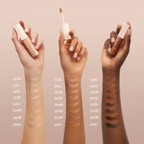 Light beige Lancome Tiuw CG Concealer in a transparent tube with a white cap and doe-foot applicator.