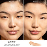 A creamy, fair-light concealer swatch with warm yellow undertones, swiped in a curved line.